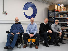 The management team sitting on Capra robots