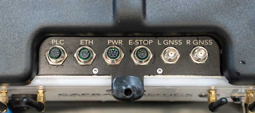 the connector plate with ports for PLC, ETH, PWR, E-STOP, L GNSS and R GNSS